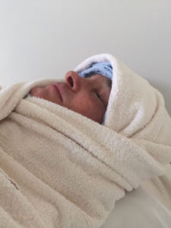 Preparation: The face is gently massaged and wrapped in warm towels